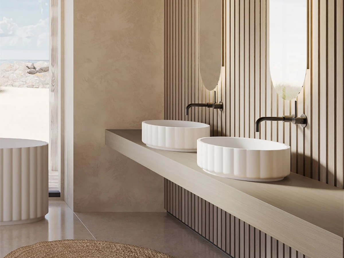 De que materiais são feitos os lavatórios nas casas de banho